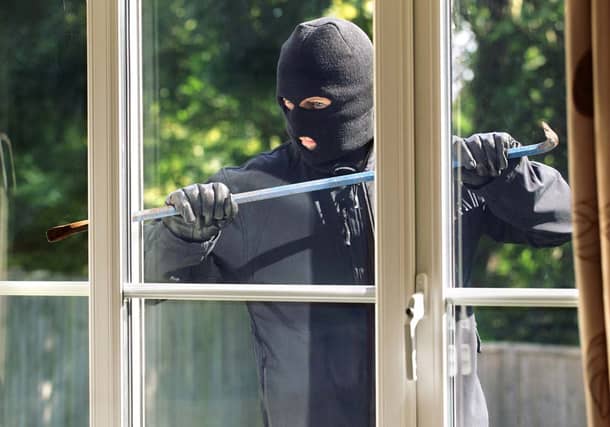 What type of individual spends time on the internet trawling through death notices to plan a break-in while a family attends a funeral?