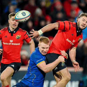Alex Nankivell, of Munster Rugby, is tackled by Ciarán Frawley, of Leinster Rugby, during the URC derby fixture at Thomond Park on Saturday evening