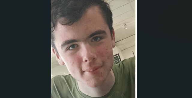 He is described as being approximately 6 foot 3 inches in height, with a slim build, dark brown hair and blue eyes