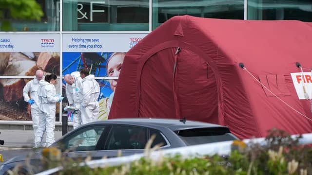 Garda forensic experts at the scene of the fatal shooting at the Fairgreen Shopping Centre in Carlow | PICTURE: PA