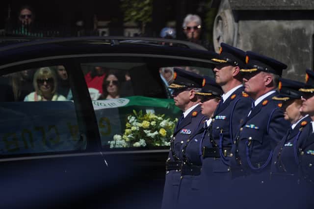 Irish President Michael D Higgins, Taoiseach Micheal Martin and Tanaiste Simon Harris were among the crowds of mourners who attended the funeral service for the 49-year-old married father-of-two in Balbriggan on Friday.