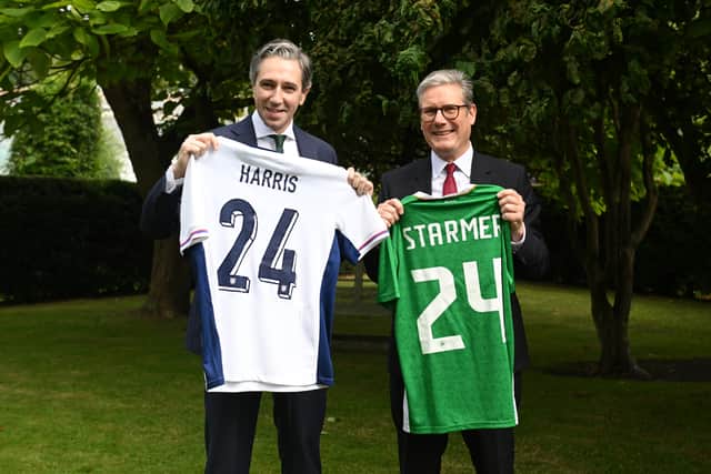 A young boy who received medical treatment in the UK had earlier presented the two leaders with Irish and English football scarves and they also swapped football jerseys.