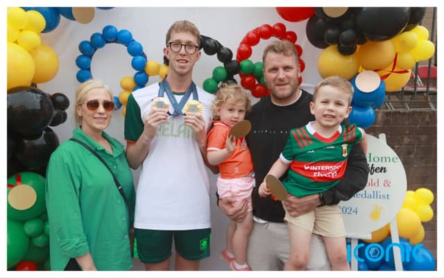 Gold and bronze medal winning swimmer Daniel Wiffen meets Michelle O’Malley, her husband Dessie and their two children Nellie, 3, and Theodore, 4, from Lurgan