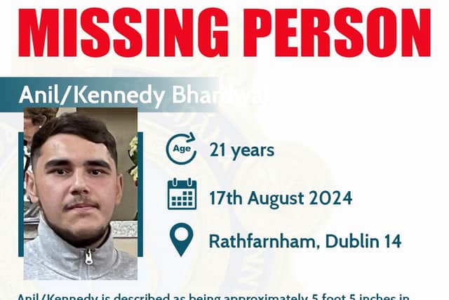 He is described as being approximately 5 foot 5 inches in height, with a heavy build, brown hair and brown eyes.