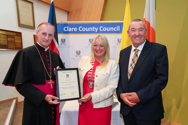His Excellency, Archbishop Séamus Horgan, is presented with a Ceremonial Scroll by Leas-Chathaoirleach of Clare County Council, Cllr Mary Howard & Chief Executive of Clare County Council, Pat Dowling