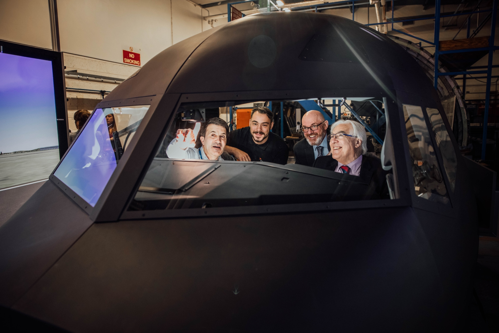 Aviation School training manager, Michael Hayes, shows apprentice Derek Schmidt and Limerick and Clare ETB's chief executive George O'Callaghan and director of FET, Paul Patton the new simulator