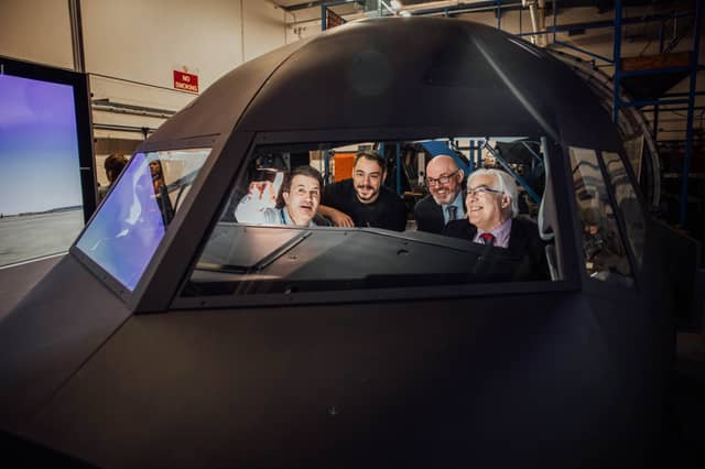 Aviation School training manager, Michael Hayes, shows apprentice Derek Schmidt and Limerick and Clare ETB's chief executive George O'Callaghan and director of FET, Paul Patton the new simulator
