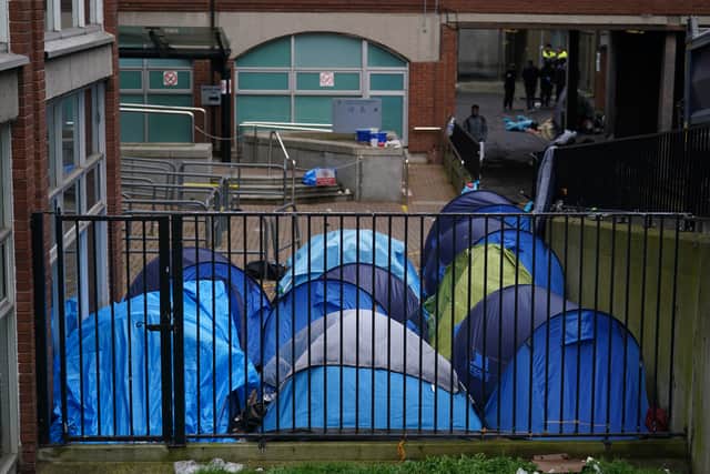 Men who had been camping near the IPO were taken by bus to the site.