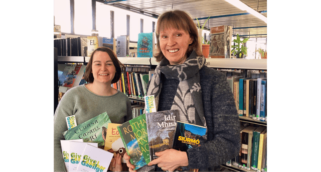 Executive Librarian Catherine Griffin and Branch Librarian Aoife Breslin prepare for Seachtain na Gaeilge at Ennis Library