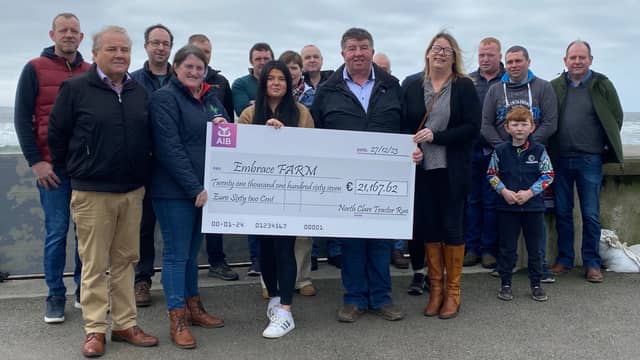 David Brennan and Sharon O’Halloran, pictured with John’s sister Shauna and Bill Slattery, presenting a cheque to Catherine Kenneally of Embrace Farm
