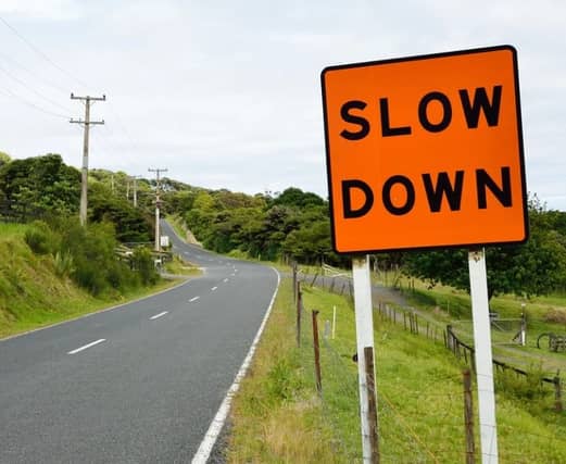 FILE PHOTO of Slow Down sign