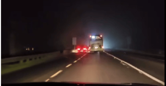 A still from the video footage which shows a driver 'undertaking' a coach