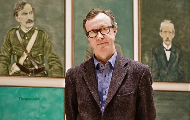 Artist Mick O’Dea with some of his artworks
