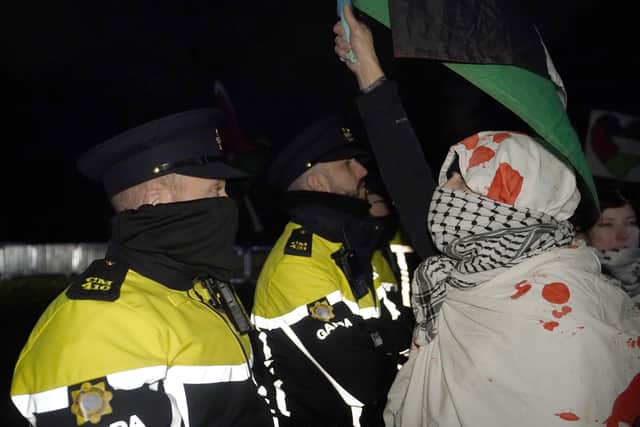 A large police deployment, including a mounted unit, was present at the scene and after some protesters blocked the roadway in a sit-down protest, barriers were erected to prevent the public approaching the residence.