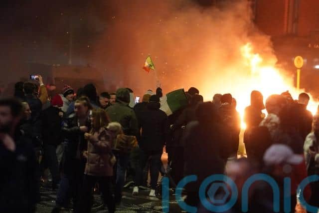 A crowd of between 100 and 200 people, some of whom wore scarves to cover their faces, confronted gardai verbally before clashes erupted with riot police.
