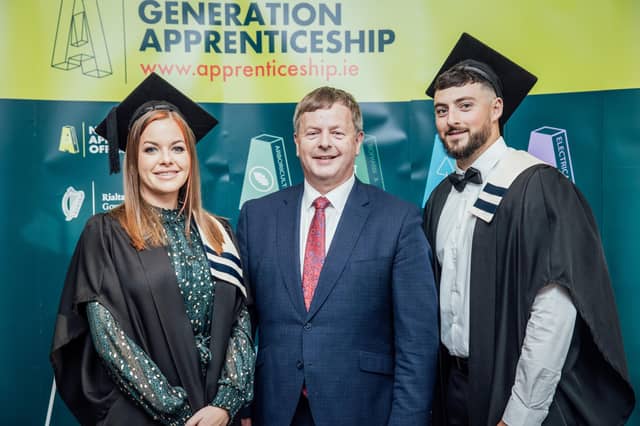 Newly qualified Kate Enright, with Jim Meade of Iarnród Éireann and graduate Dean Territt