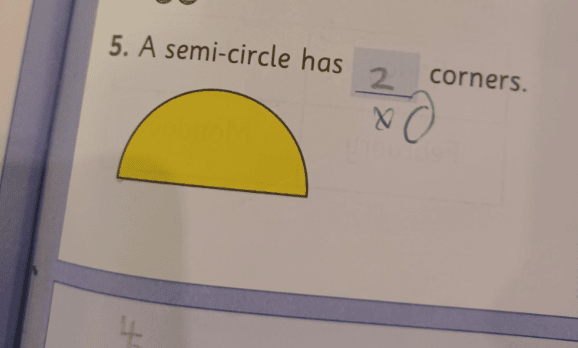 He claimed there was a "controversial ruling" from the teacher to a questions about the number of corners in a semi-circle.