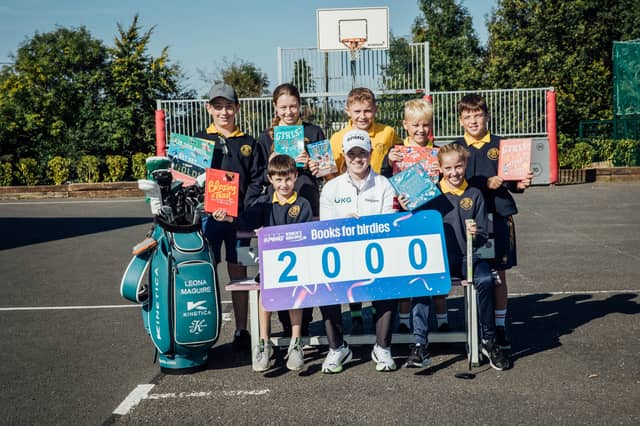 Golfer Leona Maguire with children from Clonmoney National School in County Clare.