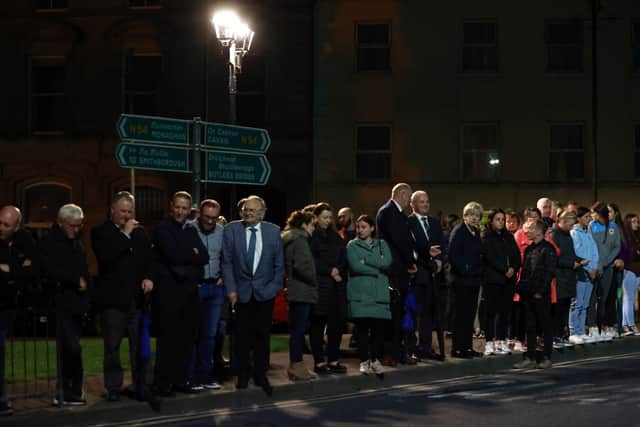 Some of those in the crowd wept and consoled each other as the hearse passed by.