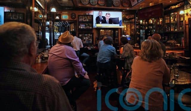 People were seen commenting and reacting to the proceedings being screened in some bars across Dublin.