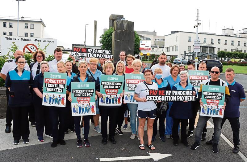 Frontline cleaning staff and security officers based at University Hospital Limerick at their demonstration | PICTURE: Adrian Butler
