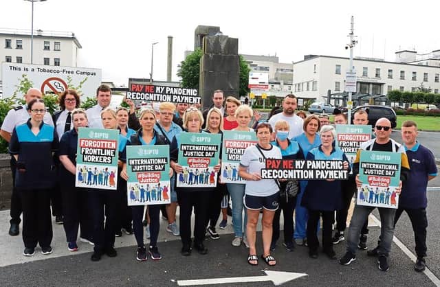 Frontline cleaning staff and security officers based at University Hospital Limerick at their demonstration | PICTURE: Adrian Butler
