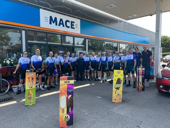 The cyclists and the support crew pictured at Mace, Mighty Mols service station, Mountrath during the event