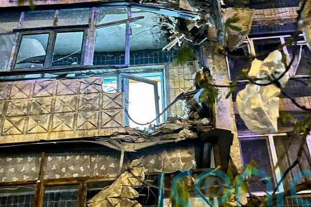 Witnesses reported a low hissing sound followed by a blast that made nearby apartment buildings tremble and threw a car on a shop roof.