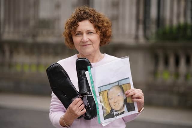 The shoes of the victims were laid on the ground outside the court alongside pictures and words from their families.