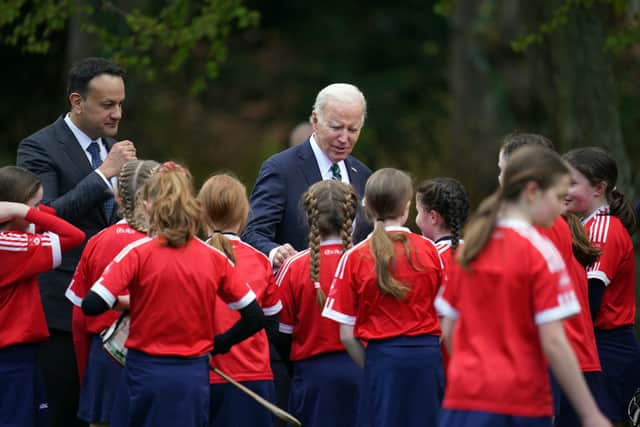 During the demonstration, a sliotar flew past the president, prompting him to quickly turn and almost break into a jog before a young girl ran past him to collect it.