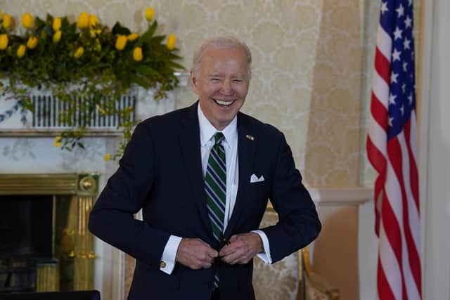 He spent almost two-and-a-half minutes writing a message in the visitors book as he sat at a small table in the residence’s state reception room flanked by an Irish tricolour and the US stars and stripes.