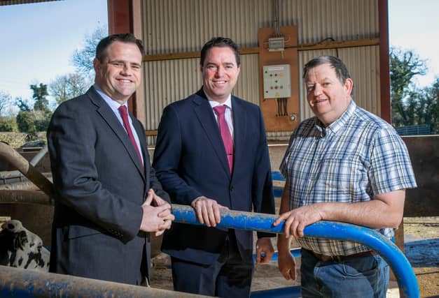 Ministers Martin Heydon and Neale Richmond with John Stone, a dairy farmer from Co. Meath