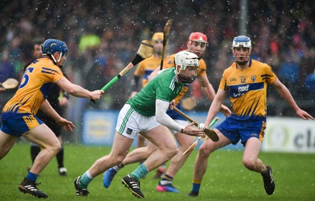 Cian Lynch evades Clare and Cratloe duo Podge Collins and Diarmuid Ryan