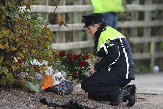 The collection of flowers grew throughout the day as many locals gathered at the scene to pay their respects.