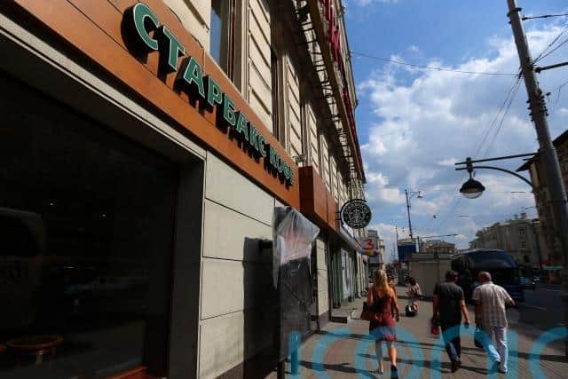 Starbucks said it will continue to pay its nearly 2,000 Russian employees for six months and help them transition to new jobs.