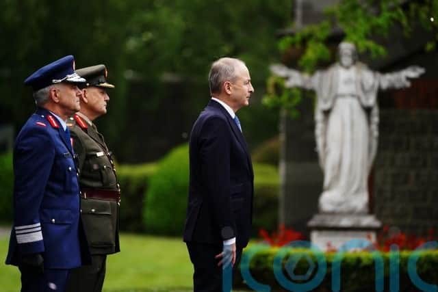 Irish Defence Minister Simon Coveney was also at the service, which included a mass and a ceremony at the grave of the 1916 leaders.