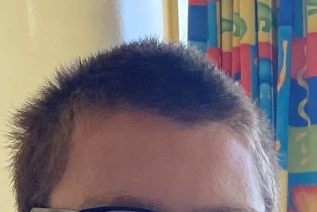Jamie is described as being approximately 5 foot 10 inches in height with a slim build, black hair, brown eyes, and wears glasses.