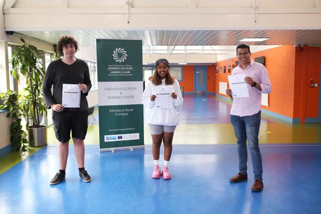 Below: Conor Hanrahan, Hayat Abdulfeta and Marcos Hernandez were all smiles after receiving their Leaving Certificate results this morning