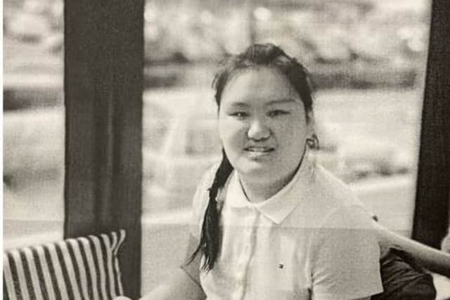 Described as being approximately 5ft 9in tall, she is of medium build, with dark hair and brown eyes.