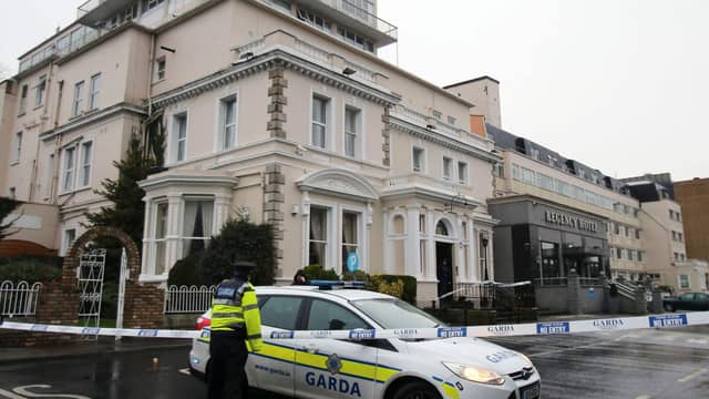 A Garda cordon outside the Regency Hotel (Niall Carson/PA)