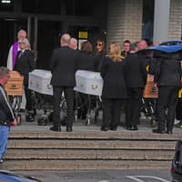 Four family members killed in arson attack arrive at church ahead of funeral
