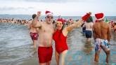 Hundreds brave the cold to make a splash for charity