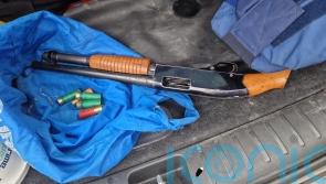 Two arrested and shotgun seized after suspect flees from car
