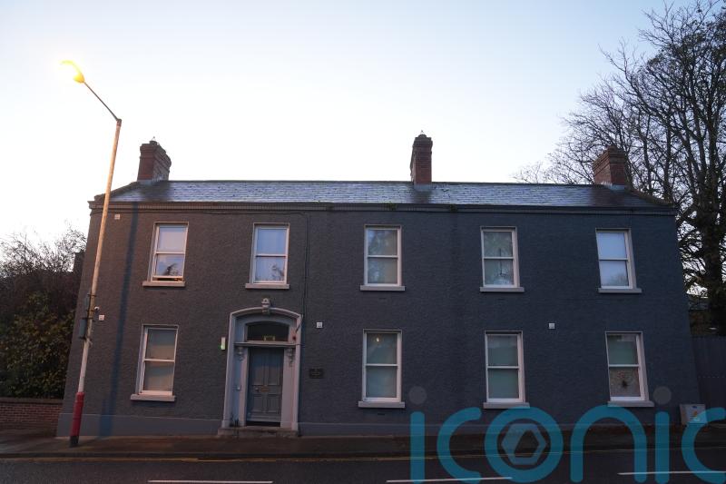 Two men charged over fire at asylum seeker accommodation centre