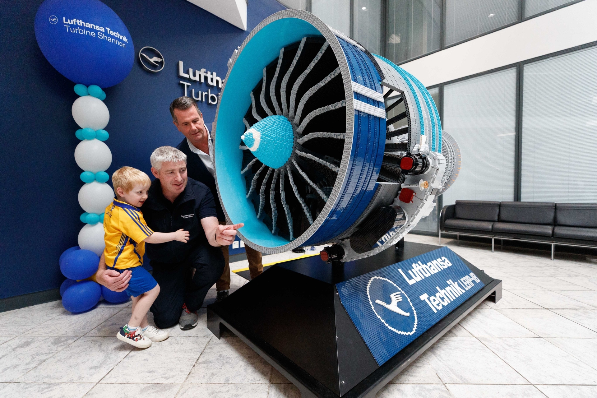 Pat Foley CEO Lufthansa Technik Turbine Shannon, Niall Griffin & 4yr old son, Kieran from Crusheen & 400000 piece Lego Aircraft Engine